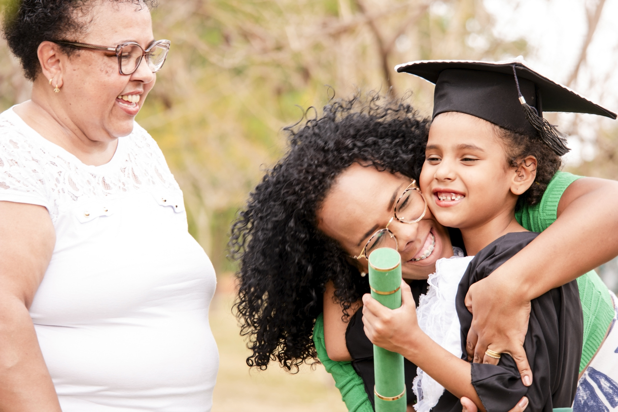 Photo of a family in the preschool graduation cerimony
