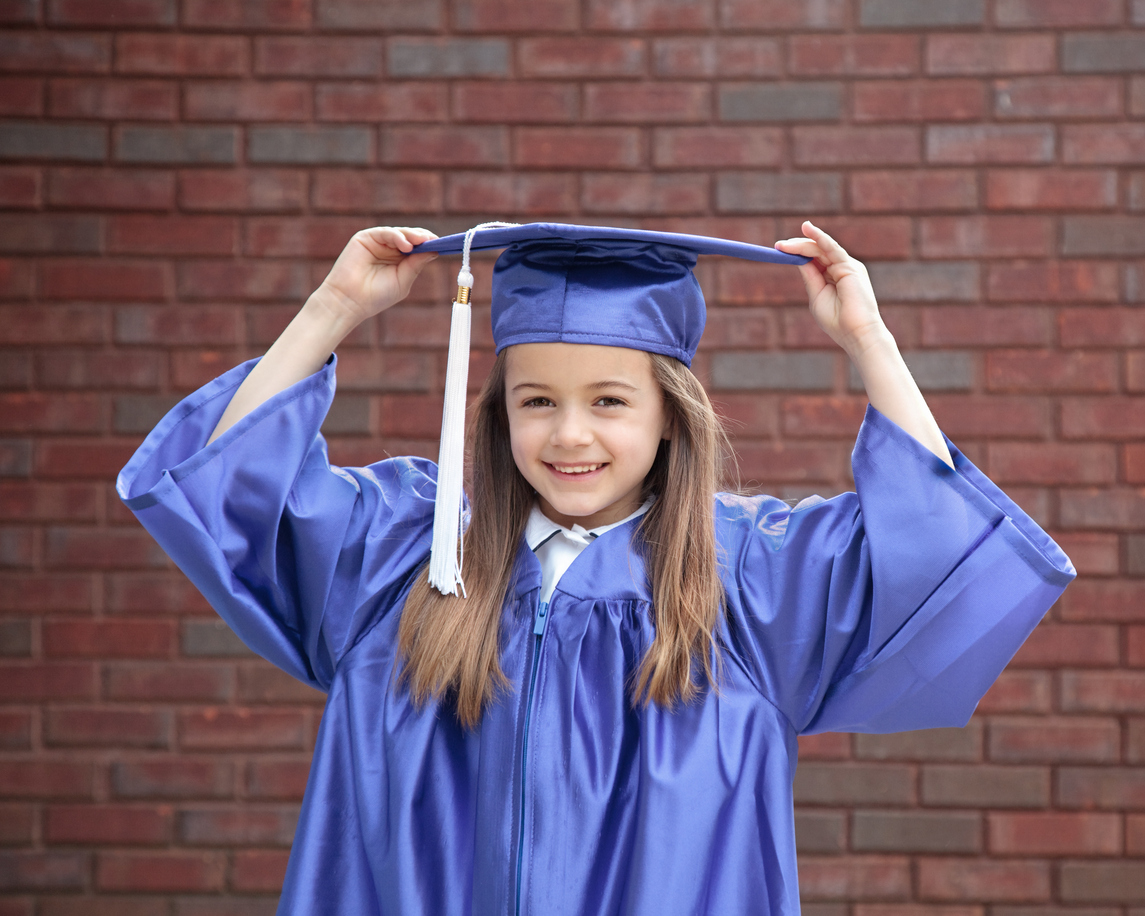 Happy little kindergarten graduate. She's excited
