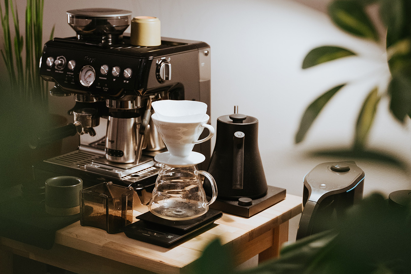 black coffee machine on wooden table