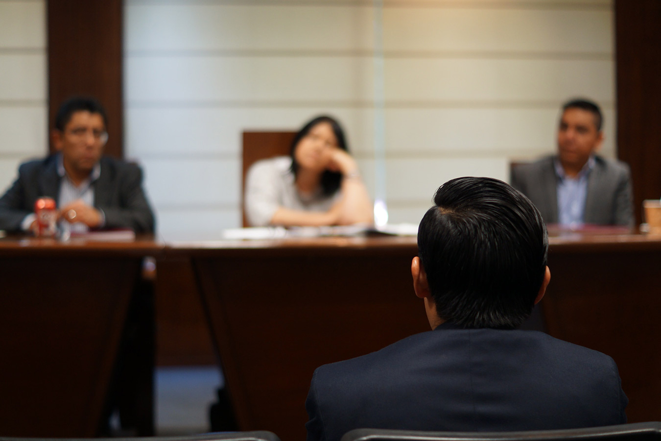 courtroom with judges in-front of lawyer