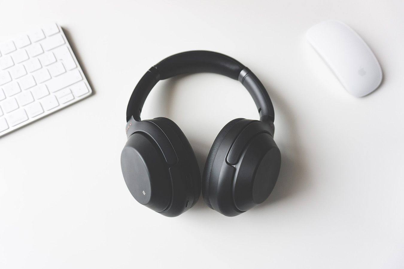 black headphones on a white table