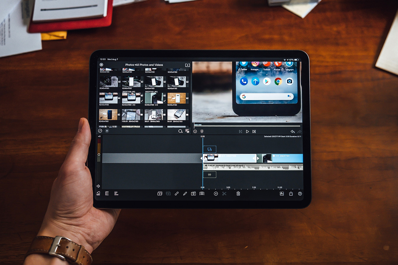 black tablet with wooden table in background