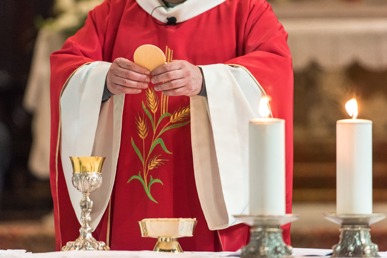 Midsection Of Priest In Church