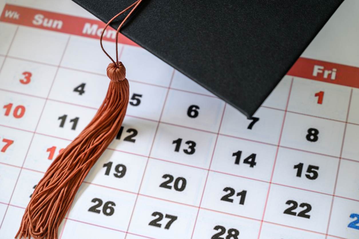 graduation ceremony graduation cap on white clean calendar