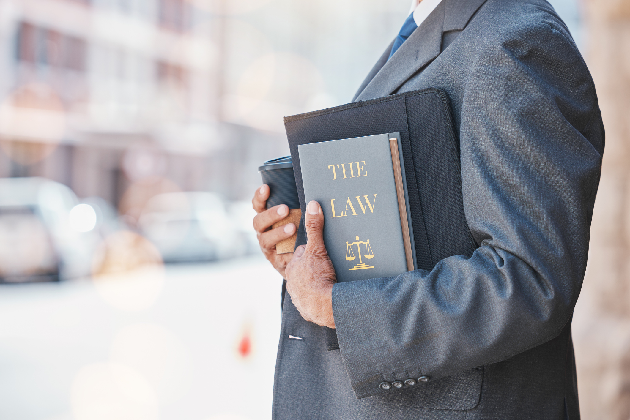 Law, book and businessman or lawyer with legal books, constitution or research on regulation or policy knowledge. Attorney, judge or information on a case in court, government or expert on laws