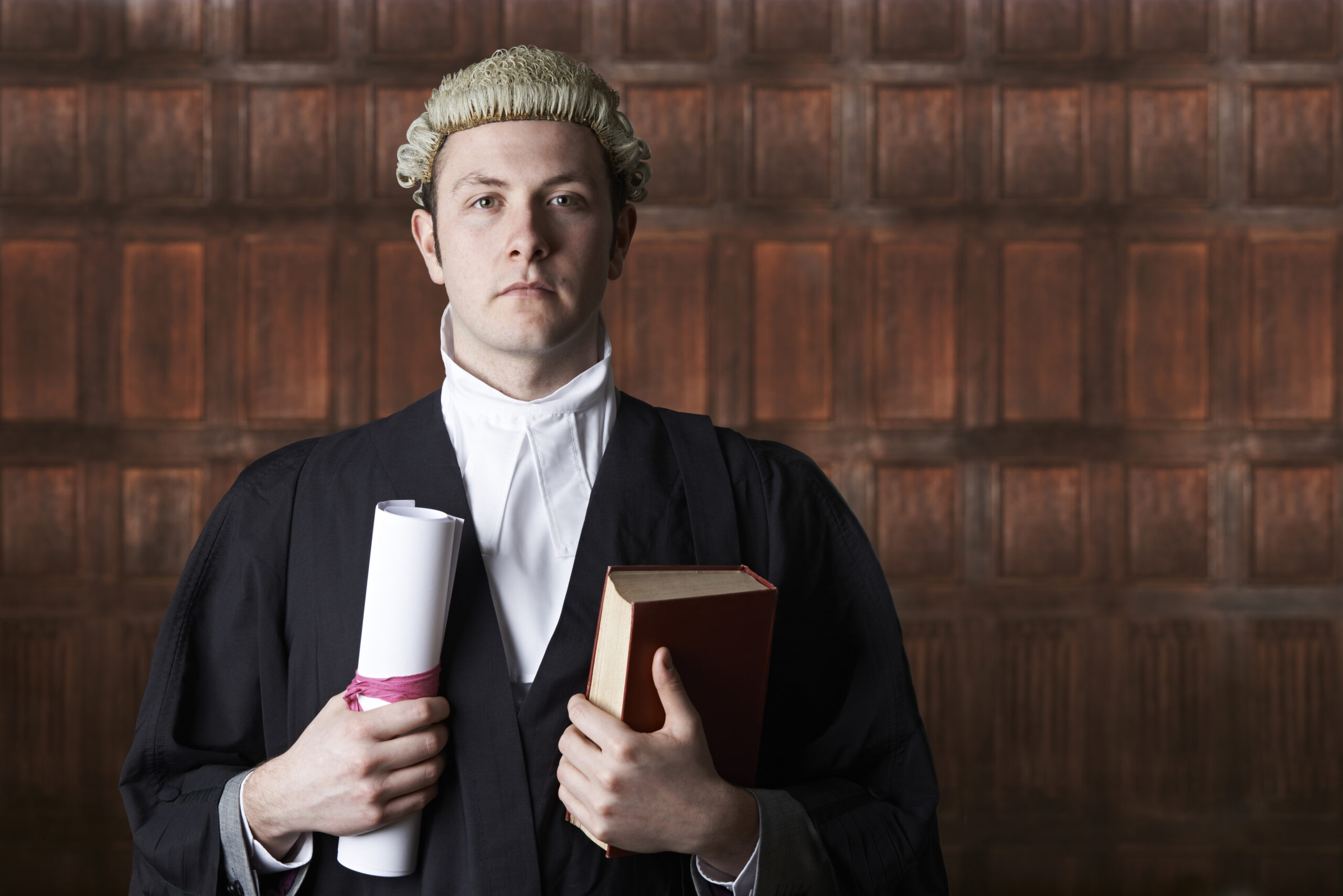 Portrait Of Lawyer In Court Holding Brief And Book